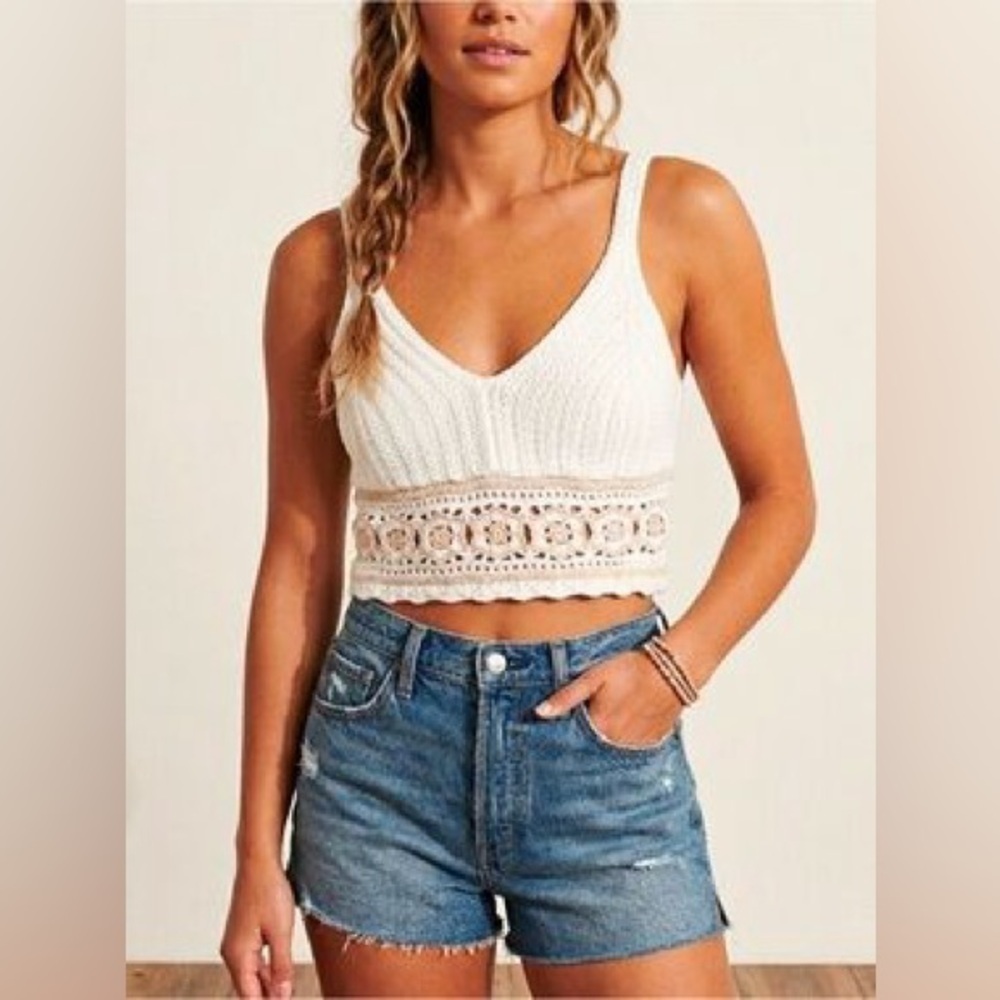 Hollister white and beige crochet cropped tank top featuring a V-neck design.